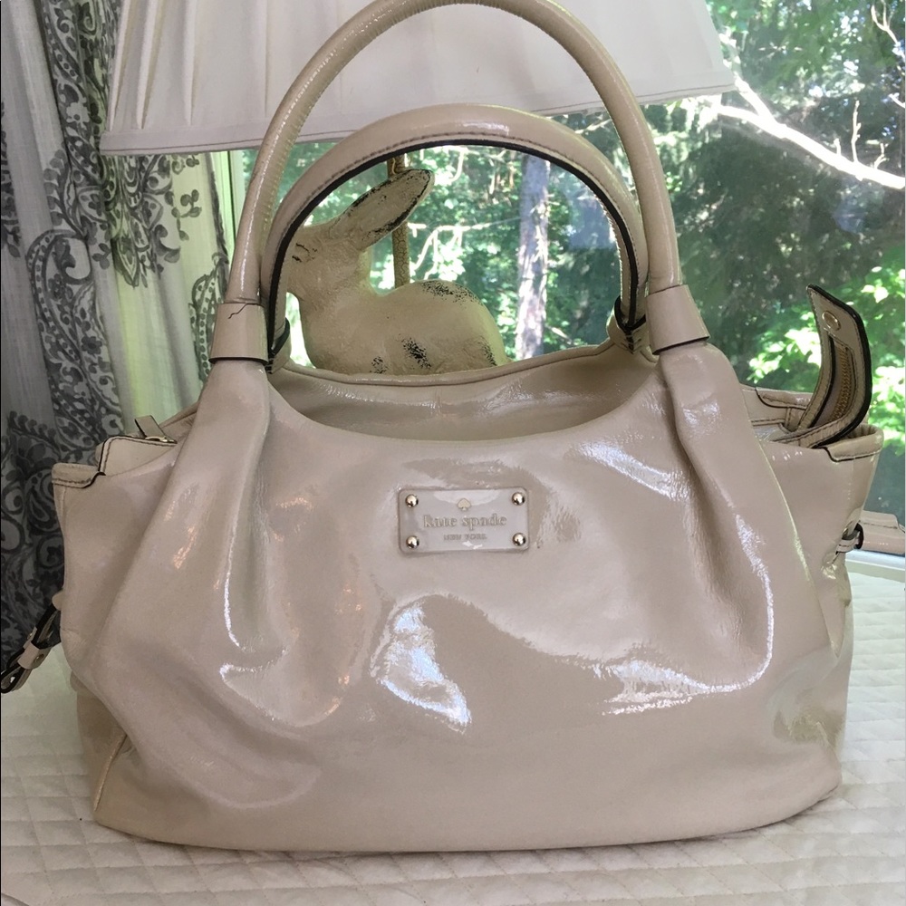 Kate Spade cream drawstring bag.